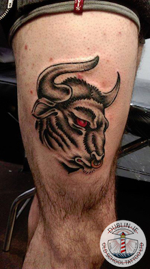 bull tattoo on leg